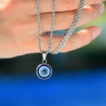 Collar-acero-tourbillon-con-amuleto-ojo-turco-mano Collar-acero-tourbillon-con-amuleto-ojo-turco-mano