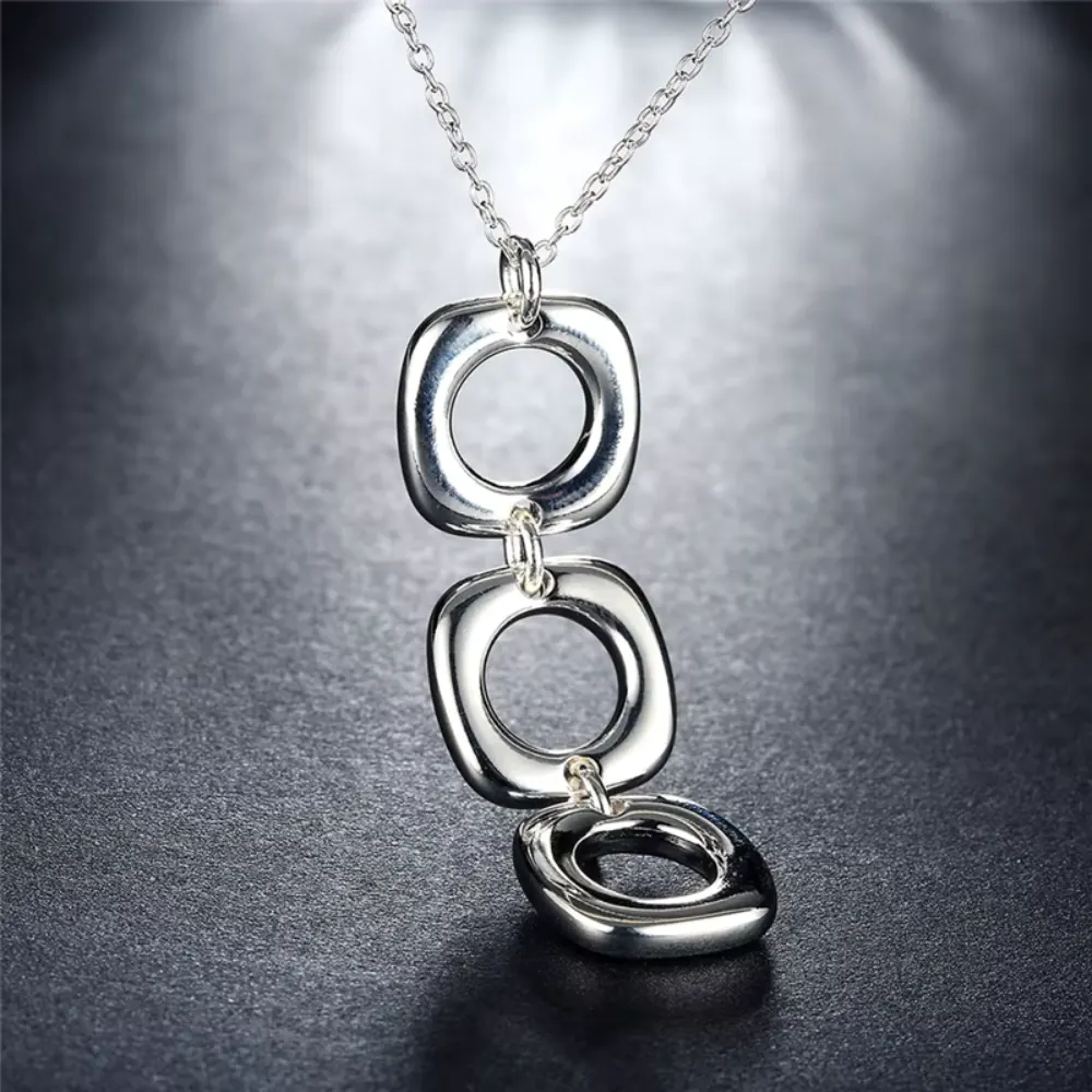 Conjunto collar y aros geométricos colgantes Conjunto collar y aros geométricos colgantes