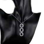 Conjunto collar y aros geométricos modelo colgante Conjunto collar y aros geométricos modelo colgante