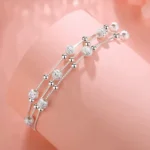 Pulsera multicapa plateada con esferas ajustable base Pulsera multicapa plateada con esferas ajustable base