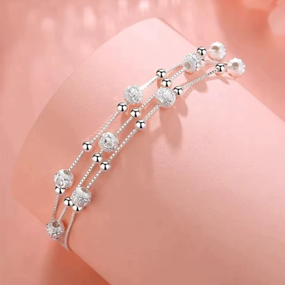Pulsera multicapa plateada con esferas ajustable base Pulsera multicapa plateada con esferas ajustable base