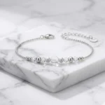Pulsera de plata 925 con bolas satinadas y cristales fondo Pulsera de plata 925 con bolas satinadas y cristales fondo