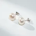 Aros de plata 925 perla achatada 12 mm fondo Aros de plata 925 perla achatada 12 mm fondo